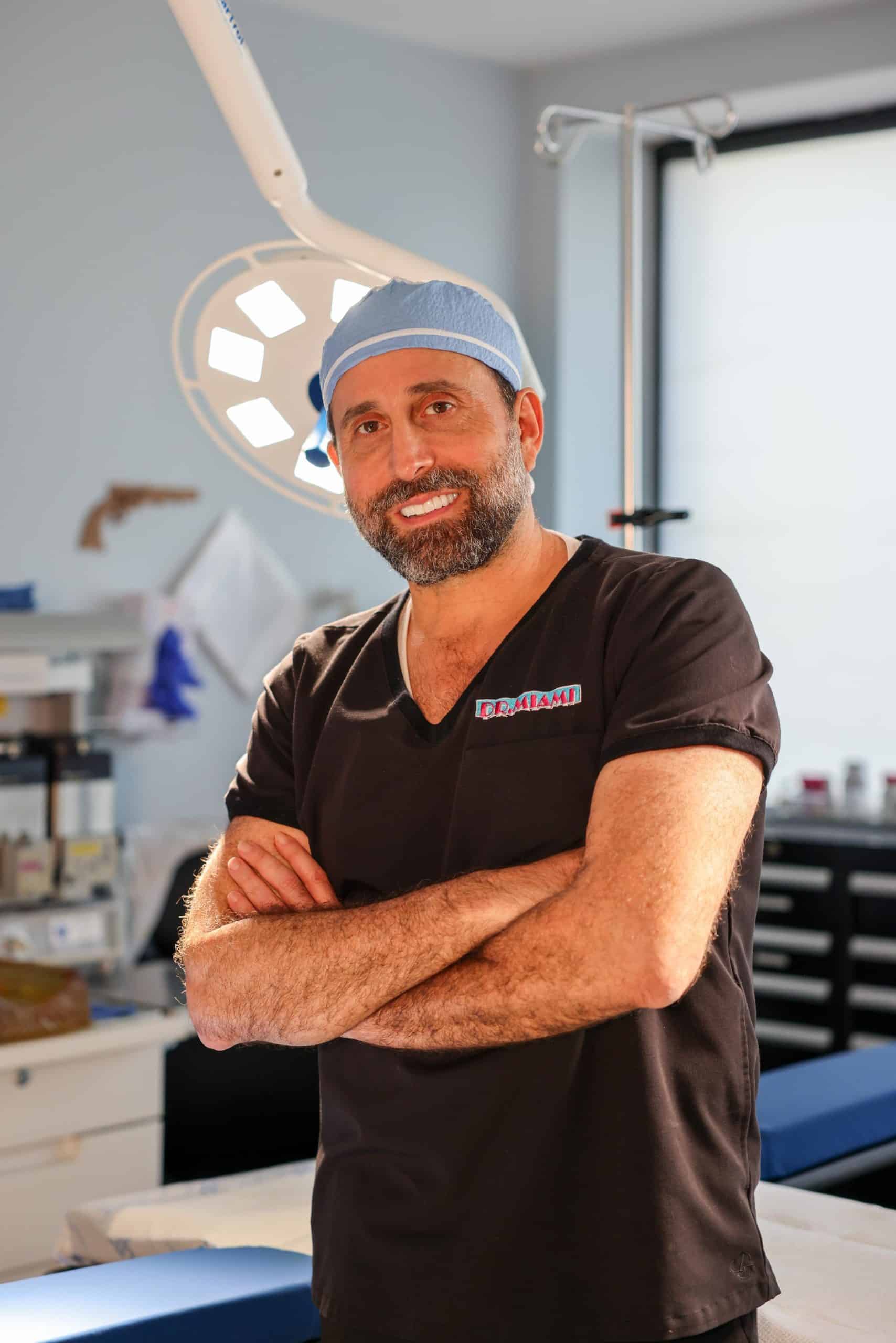 Dr. Michael Salzhauer in surgical scrubs inside a treatment room